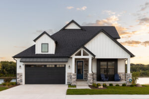 A Black And White Luxury Home With A Sunset