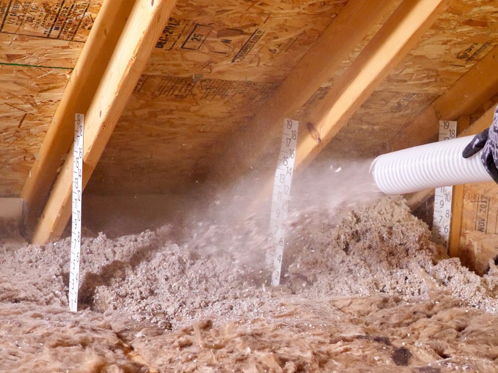 Nu-Wool Premium Cellulose Insulation being installed in an existing attic (retrofit)